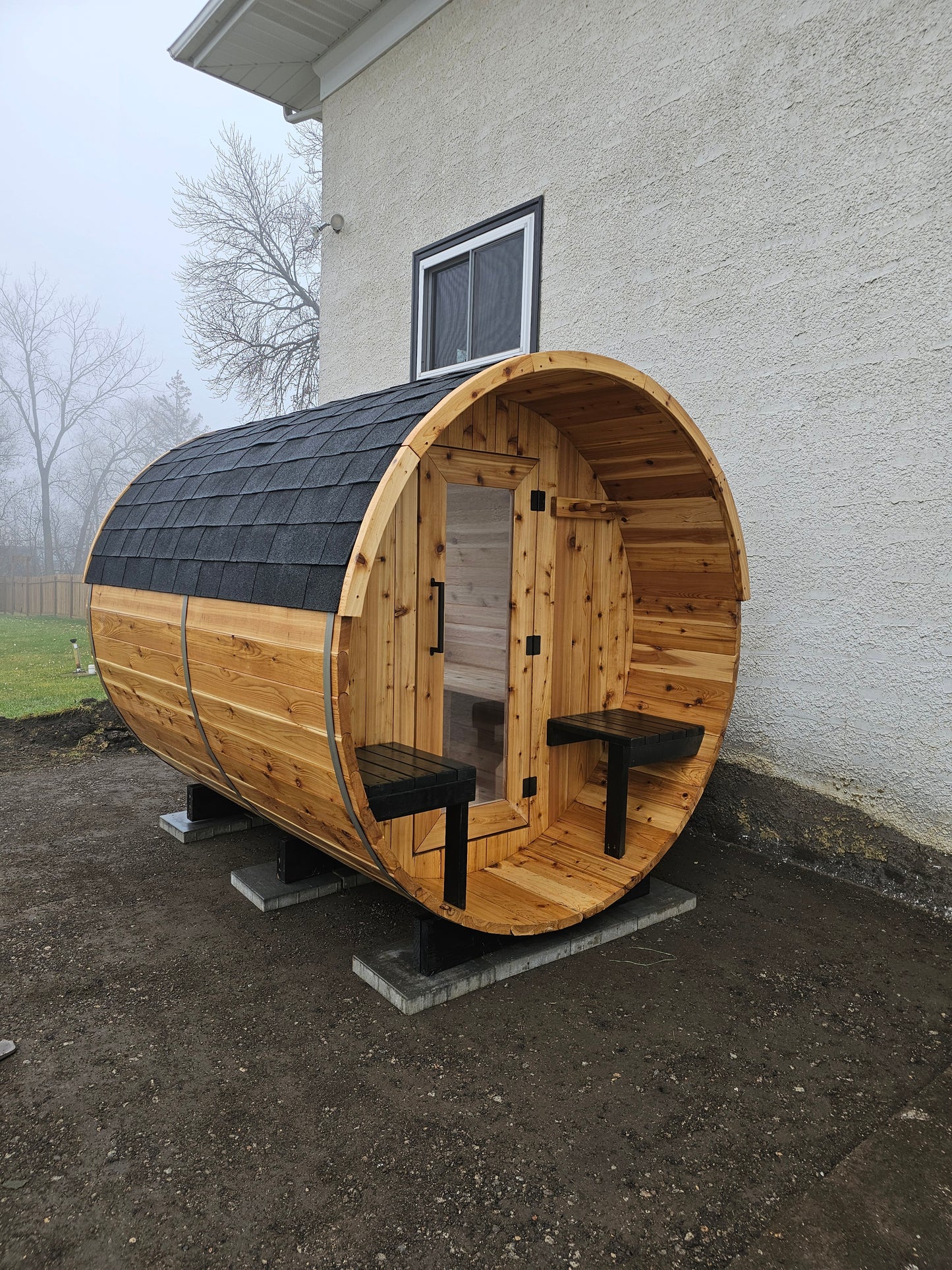 4-6 person Barrel Sauna with Harvia electric heater.