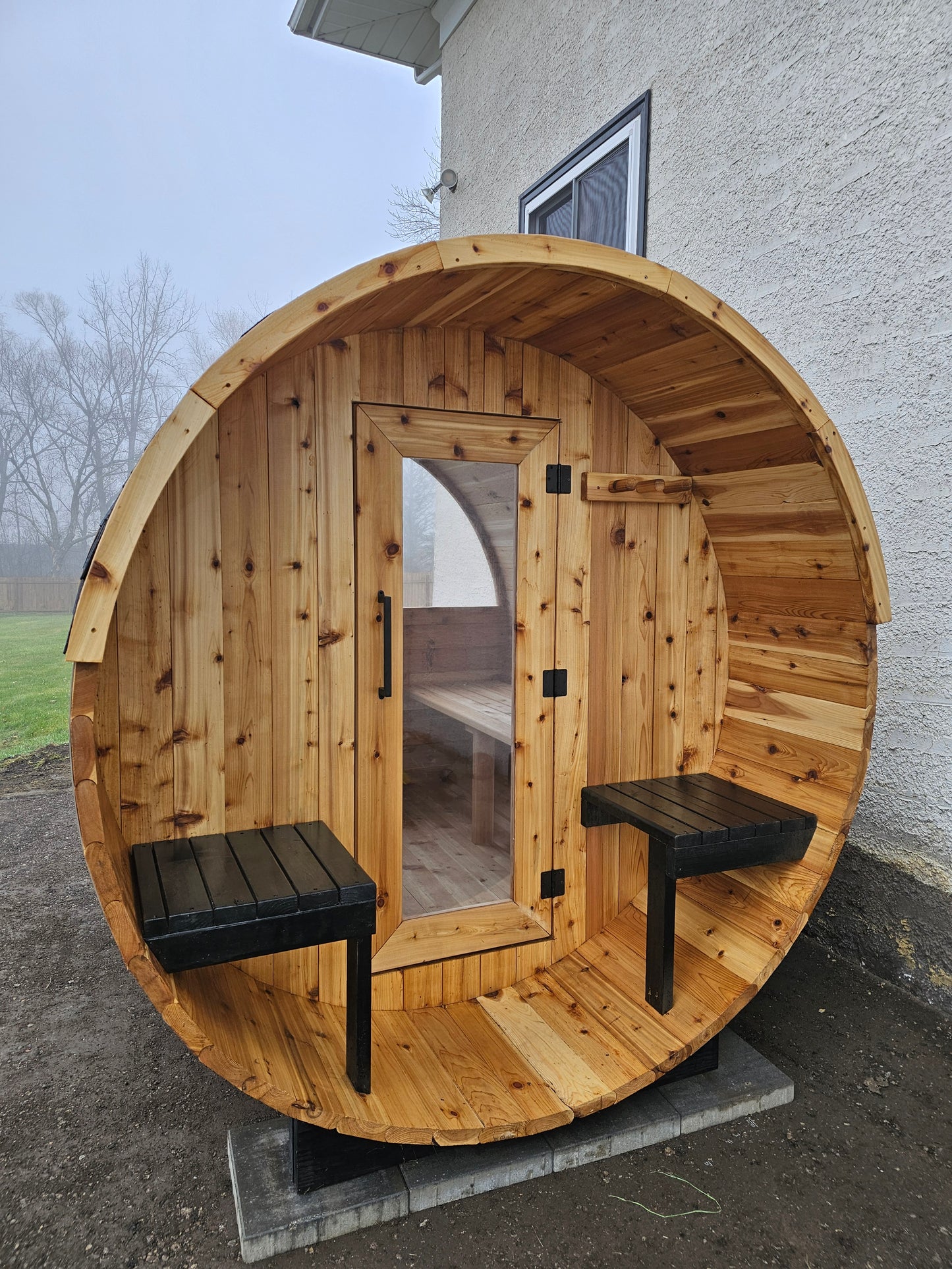 4-6 person Barrel Sauna with Harvia electric heater.